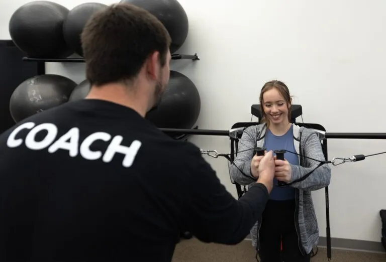 A performance coach training a client at Method Health Club in Ashburn, VA.