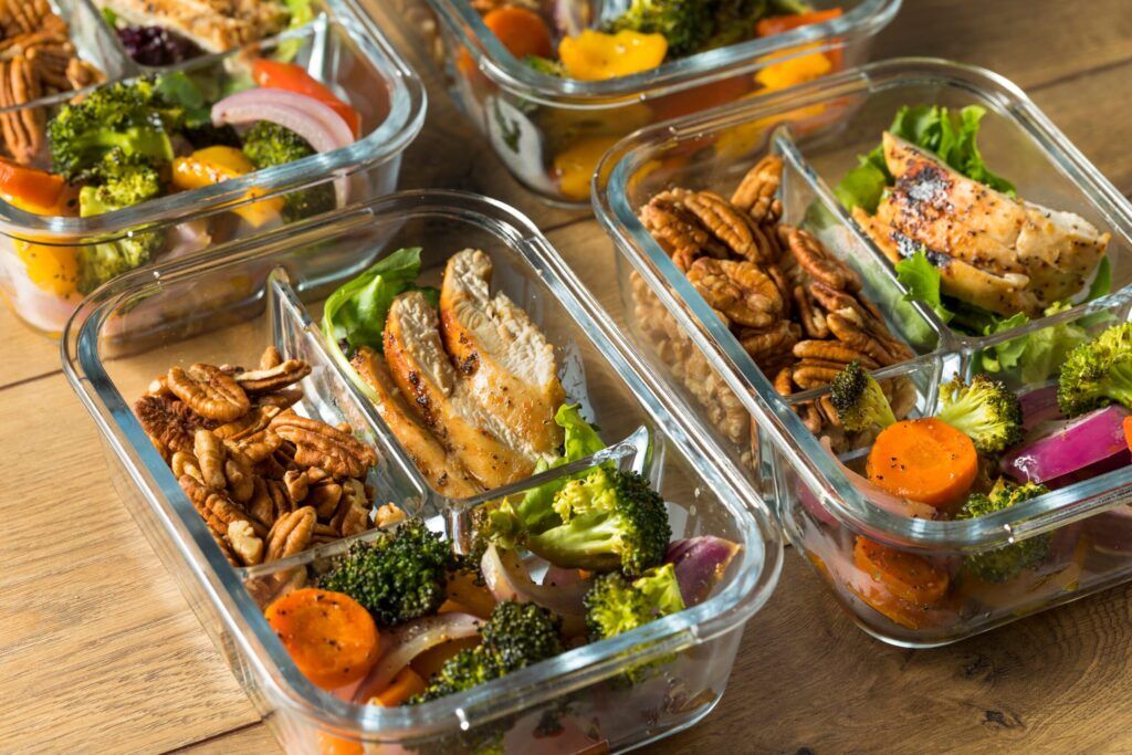 Meal prep containers filled with high-protein meals.